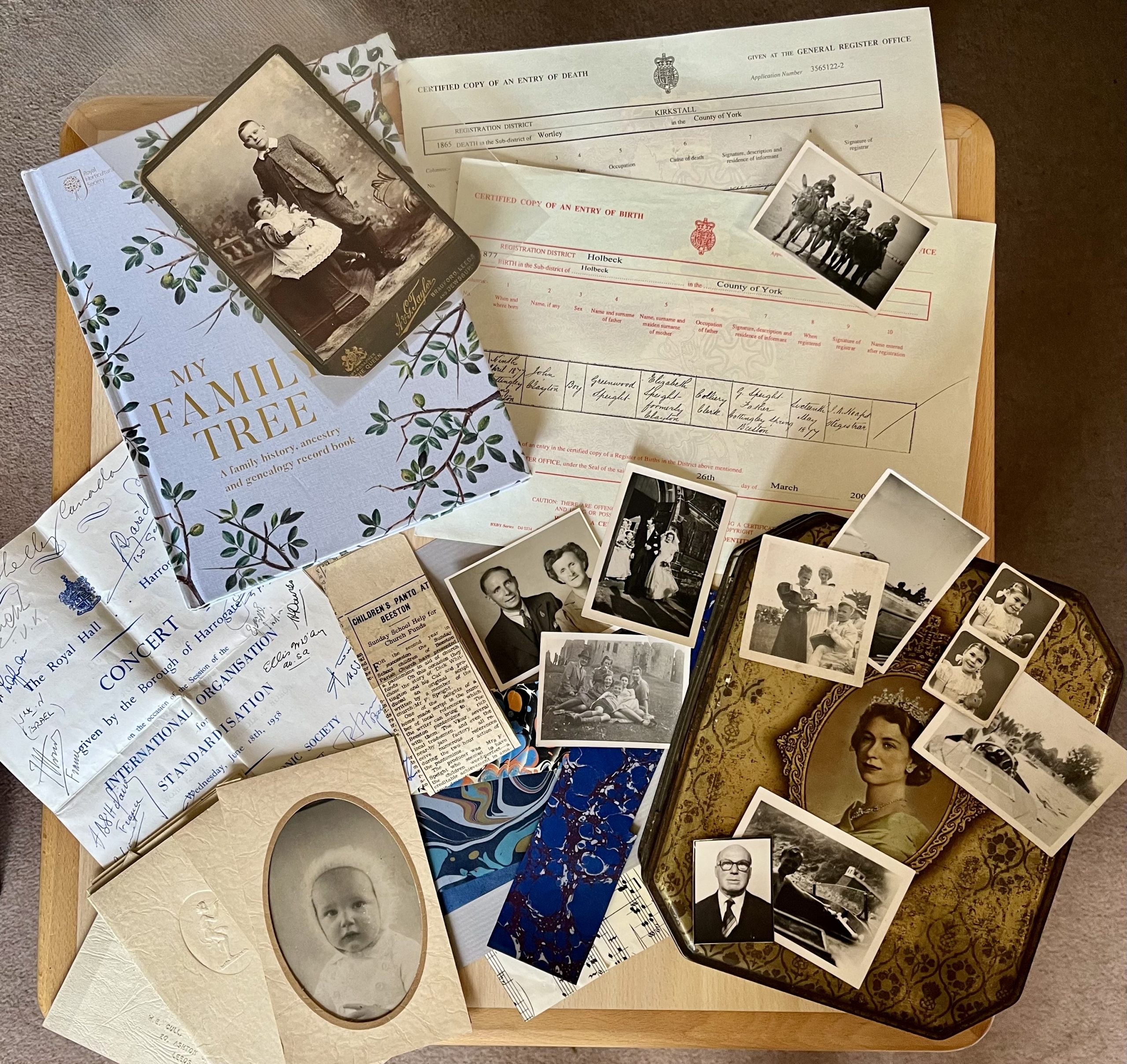 The image shows a selection of photos of people from the past in black and white and sepia laid over hand written letters