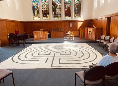 Images shows labyrinth inside a church with panelled walls