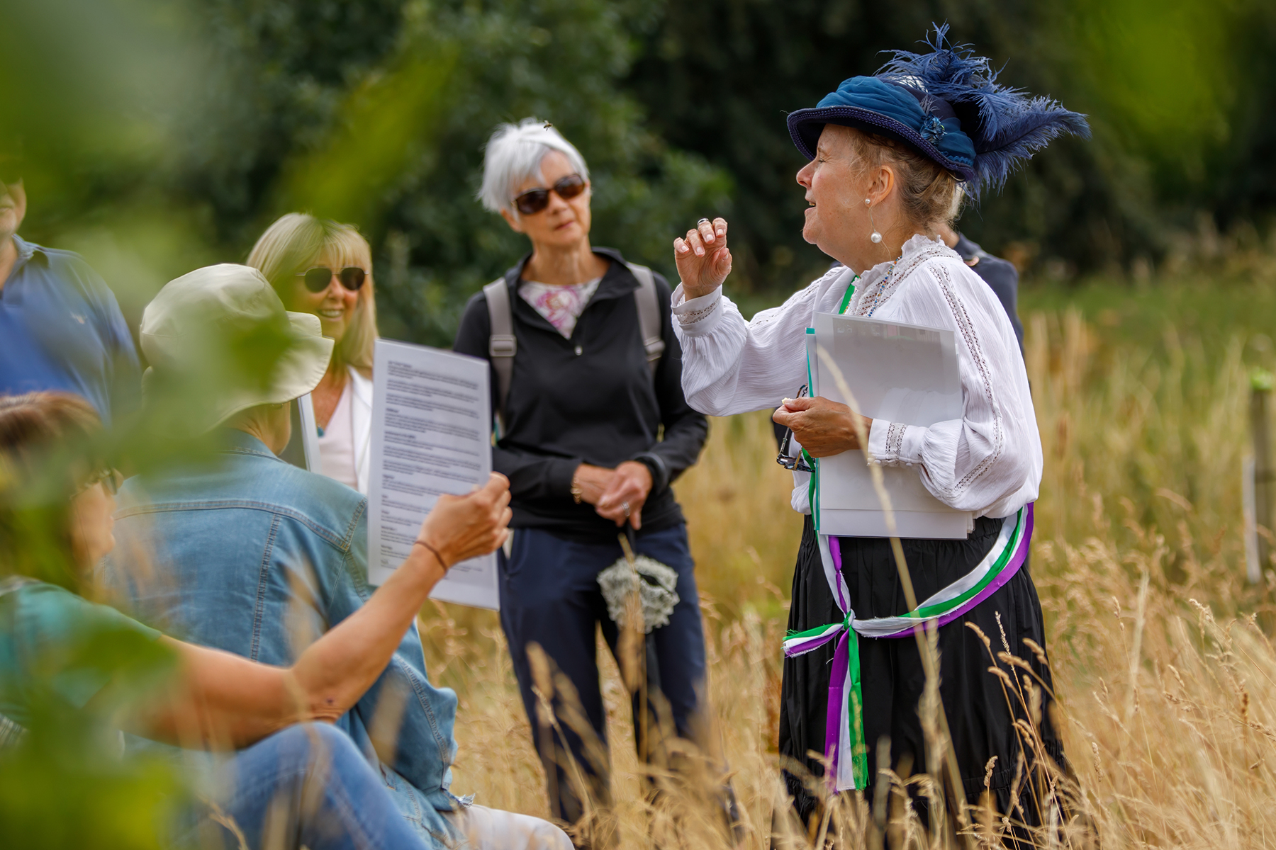Woman dressed up as Suffragette Nell Kenney