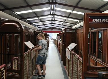 Man inside engine shed reading display