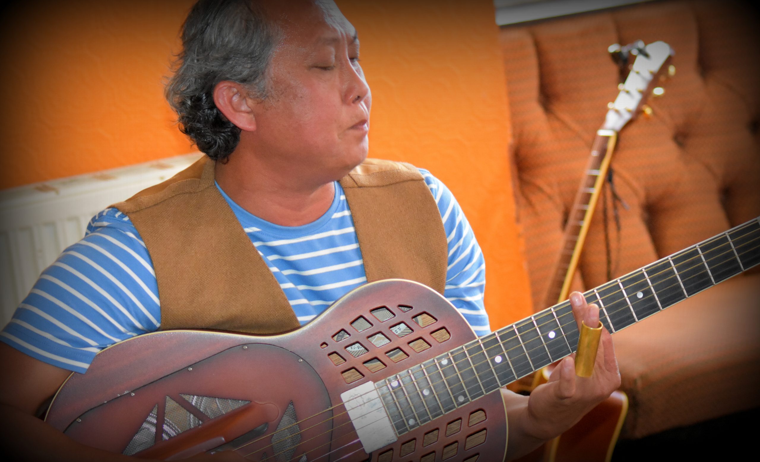A man playing a guitar