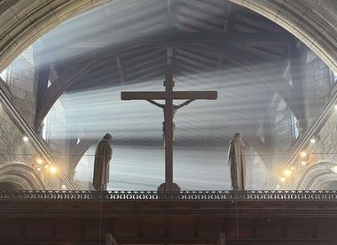 An image of a cross inside a church