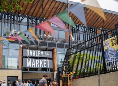 Exterior of building with sign saying Darley Market