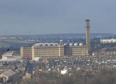 Image of large building surrounded by houses
